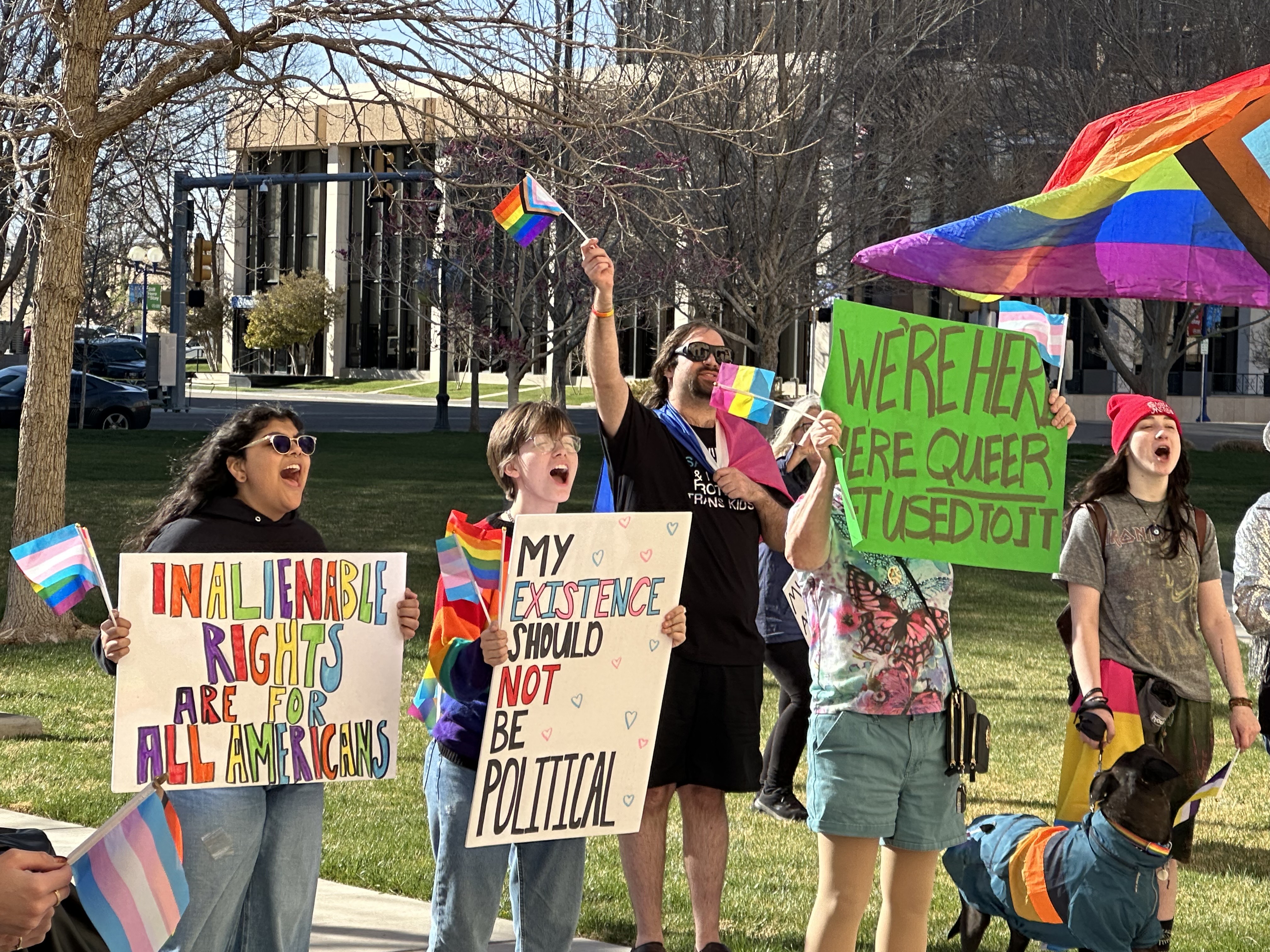 Amarillo LGBT community holding signs advocating for their rights